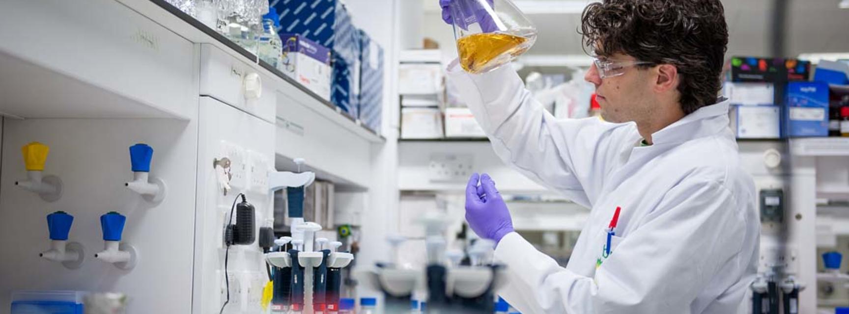 Photo of person in a laboratory carrying out research