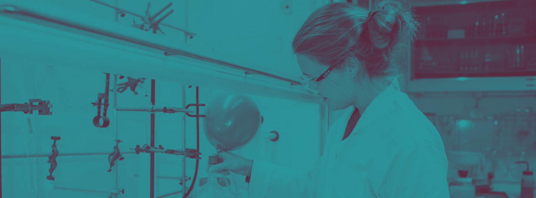 Banner photograph of a woman in lab